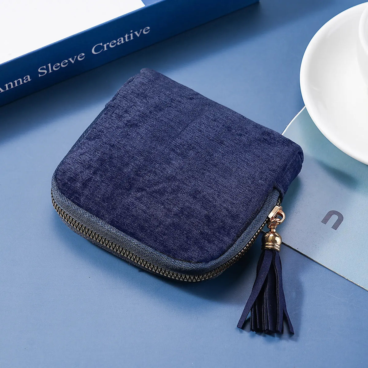Estuche azul con cremallera y borla para joyería y cosméticos