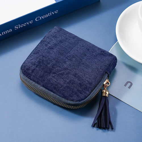Estuche azul con cremallera y borla para joyería y cosméticos